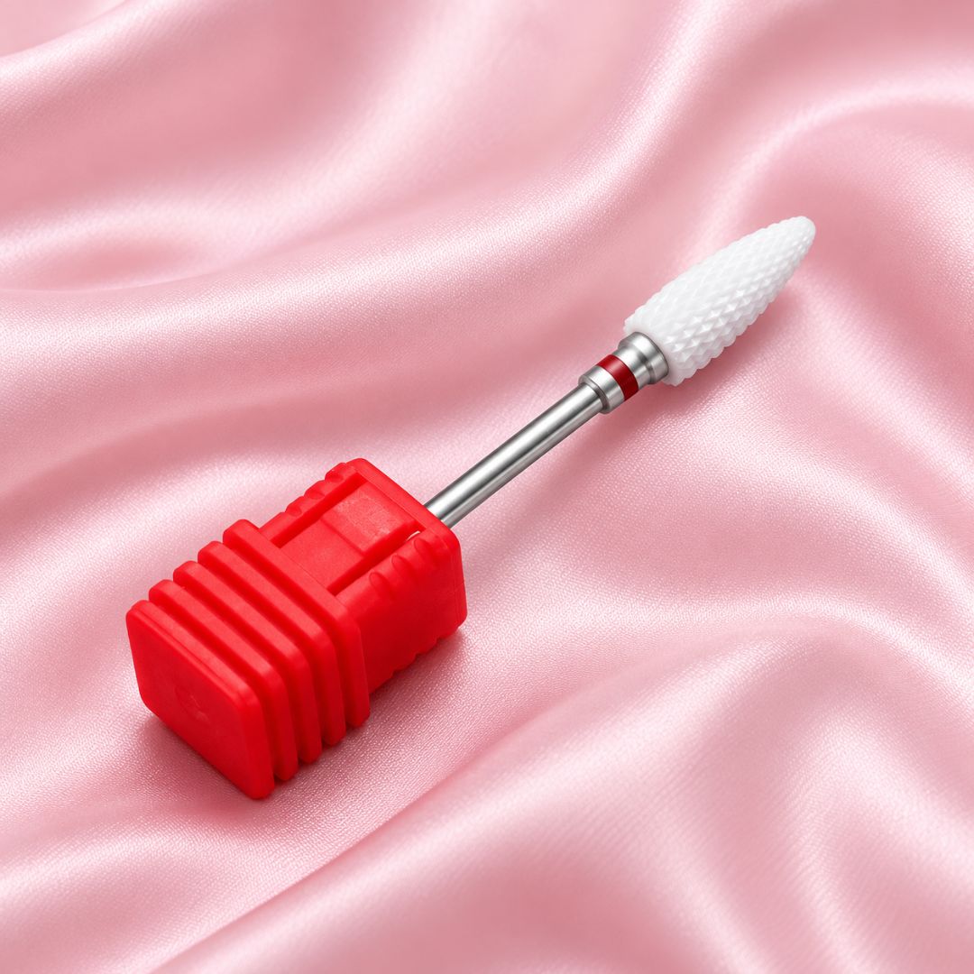 Fine tornado ceramic nail drill bit in red holder with tapered cutting head