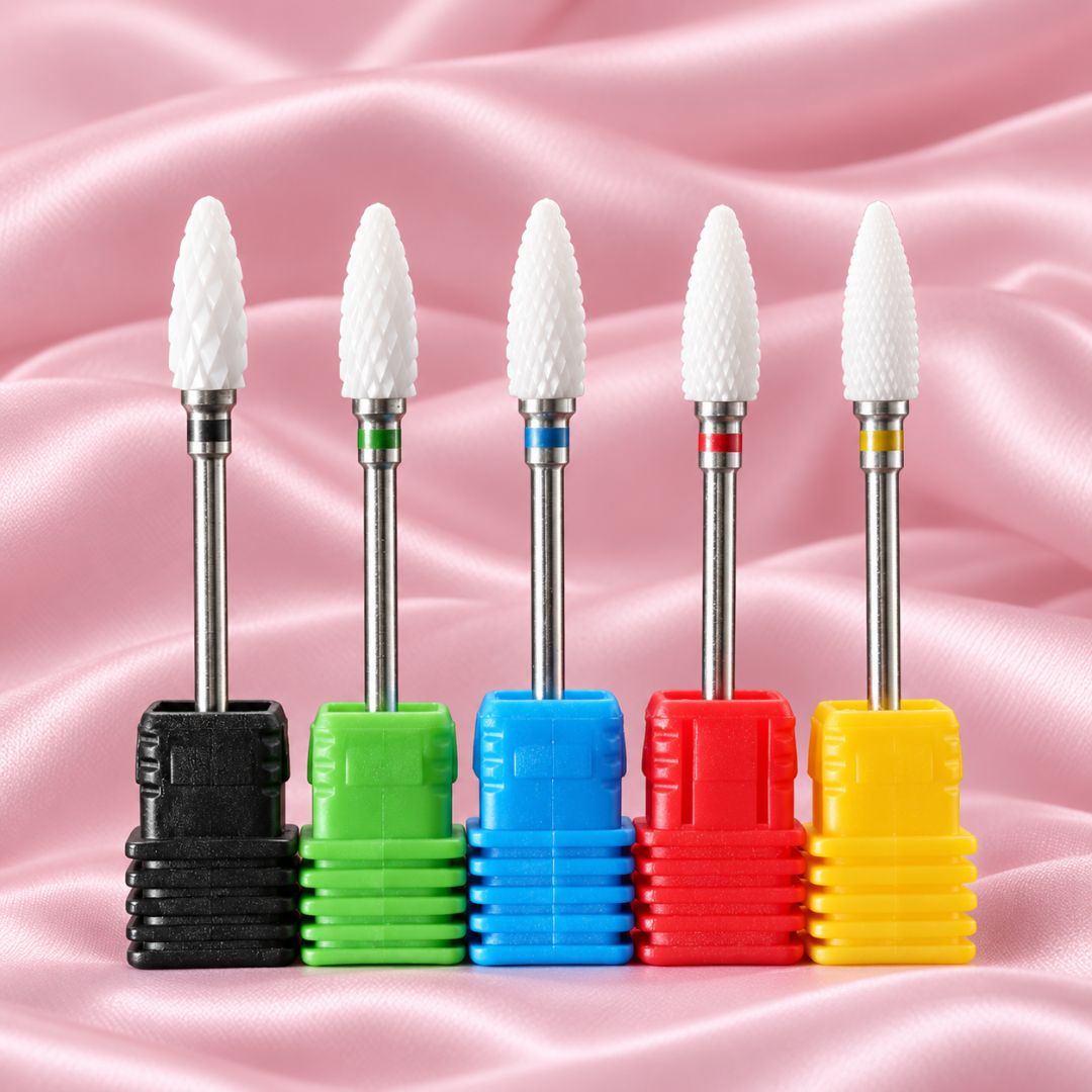 Five Tornado ceramic nail drill bits with tapered heads in colour-coded holders